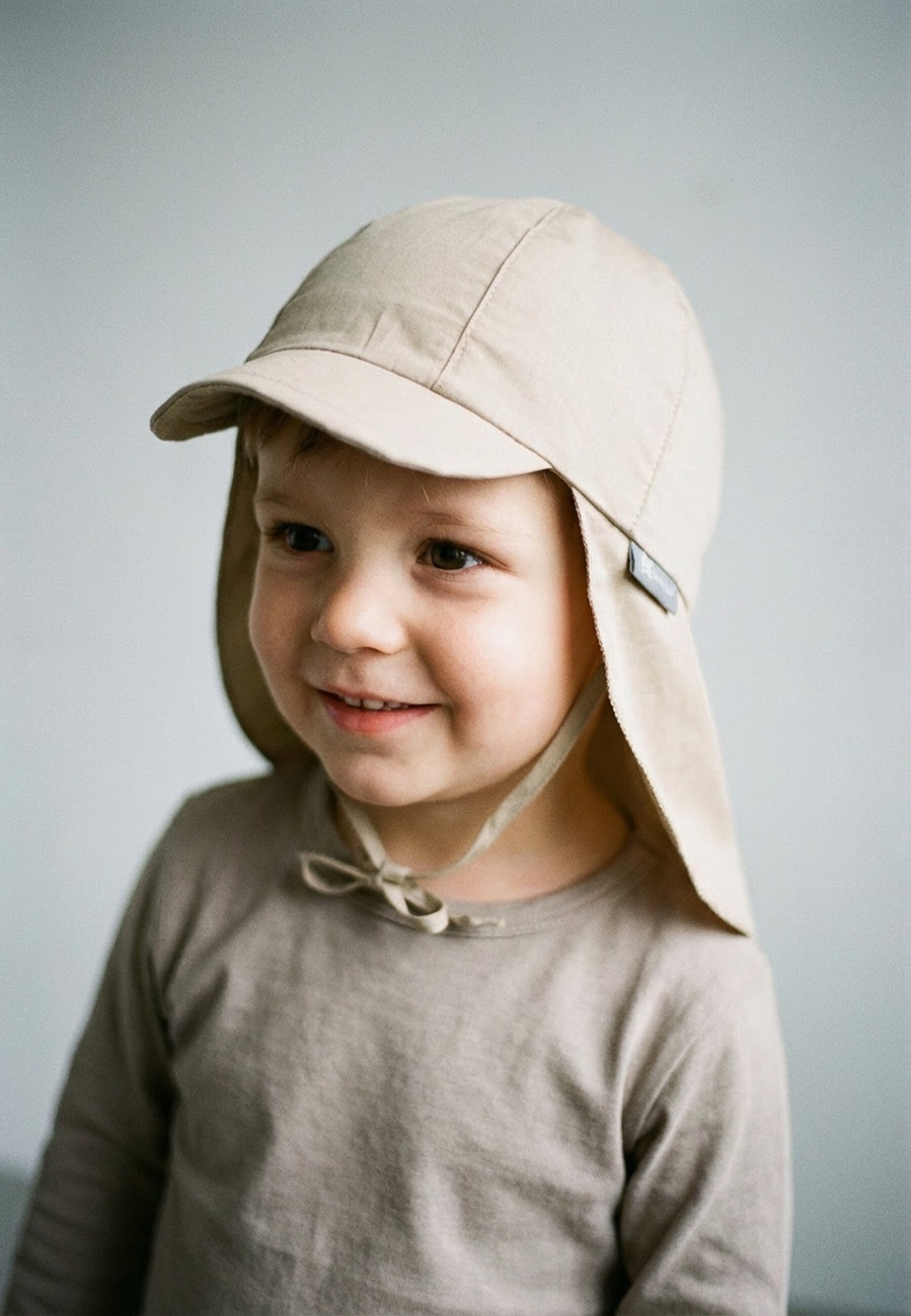 Hat with visor and neckflap