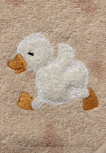 Babero con botón a presión